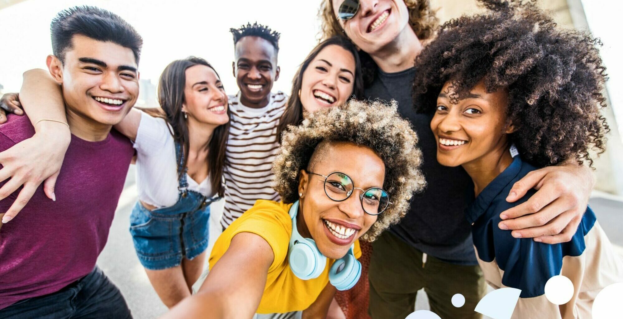 group of high school students posing for selfie